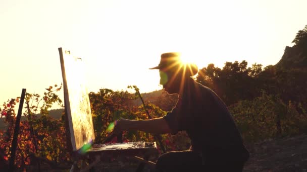 Male Artist Paints Beautiful Rural Landscape Sunset Suns Rays Glare — Stock video