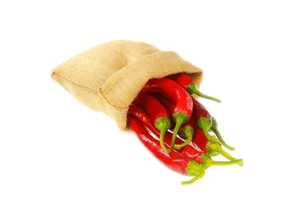 Rode paprika 's in een Jute zak — Stockfoto