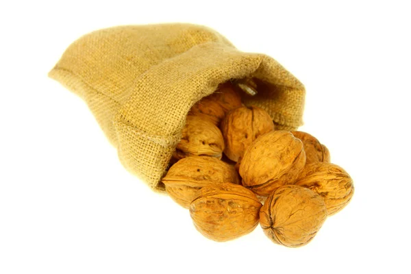 Jute bag full of walnuts — Stock Photo, Image