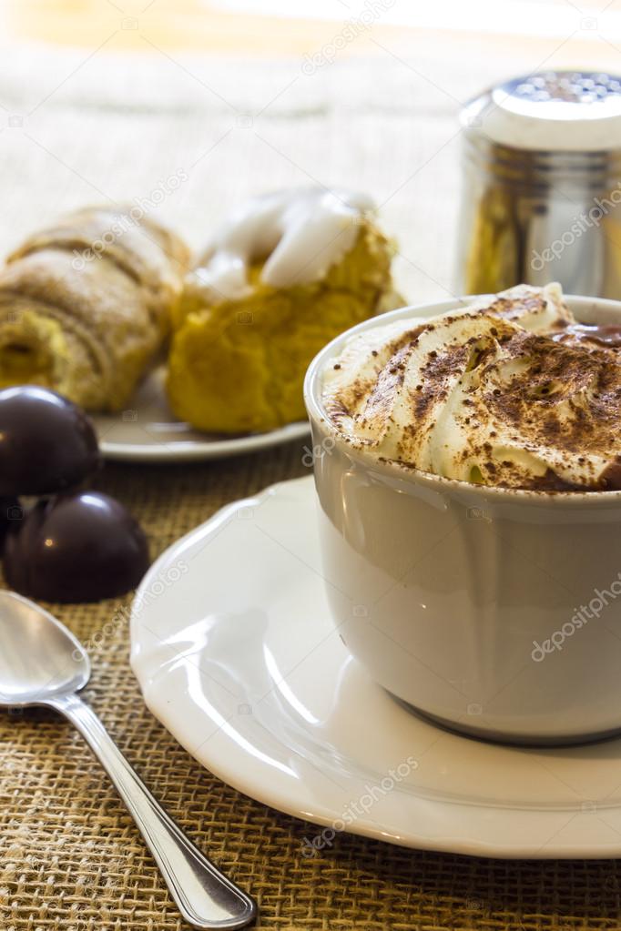 Hot chocolate cup with whipped cream