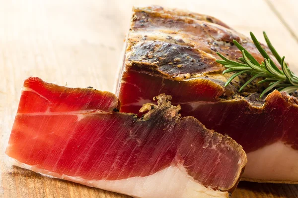 Tasty slices of Italian speck — Stock Photo, Image