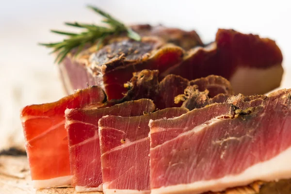 Tasty slices of Italian speck — Stock Photo, Image