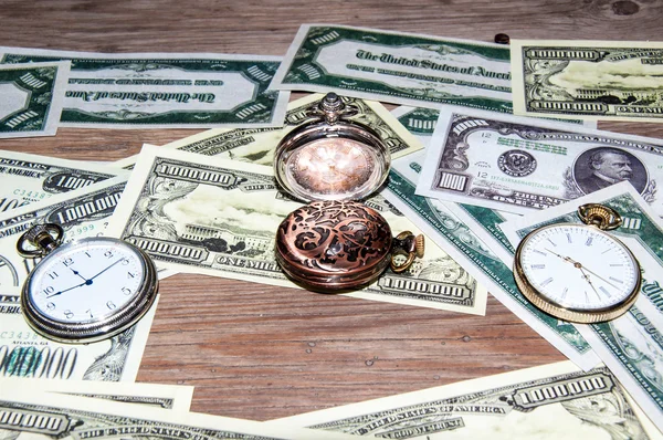 Pocket watches and money. — Stock Photo, Image