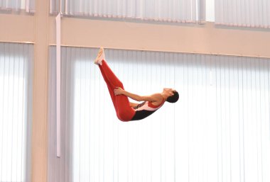 Young men are training in trampoline jumping, preparing for competitions 