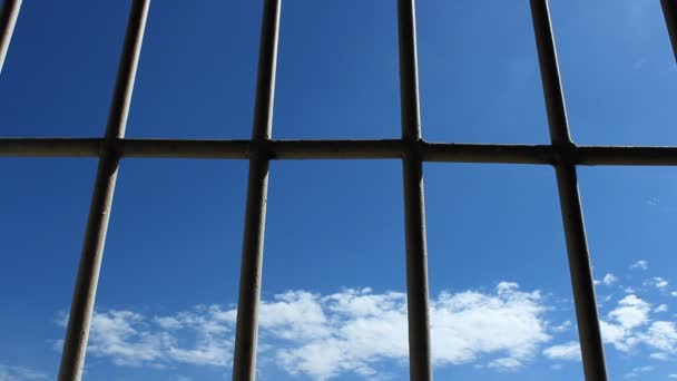 Prison bars and blue sky — Stock Video