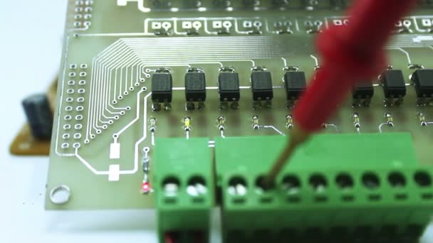 Dolly shot of a laboratory technician working on print circuit board — Stock Video