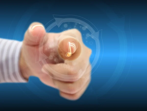 Botão de mão pressionando música na tela sensível ao toque — Fotografia de Stock