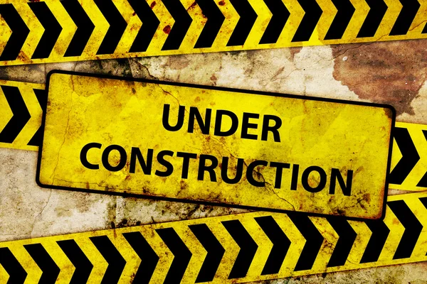 Rusty under construction sign — Stock Photo, Image