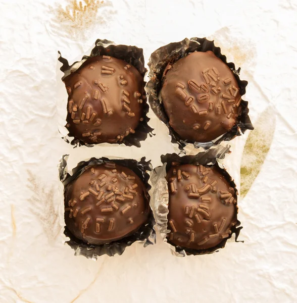 Chocolate ball on paper background — Stock Photo, Image