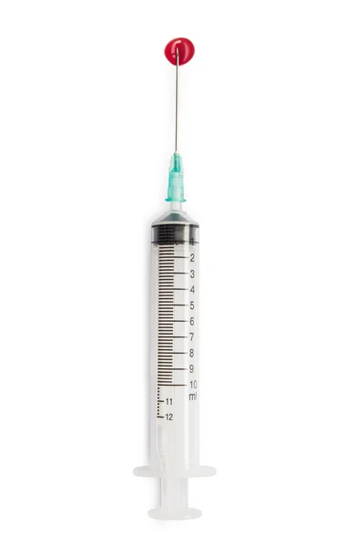Syringe with blood on the needle — Stock Photo, Image