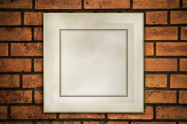 Old frame on fracture brick — Stock Photo, Image