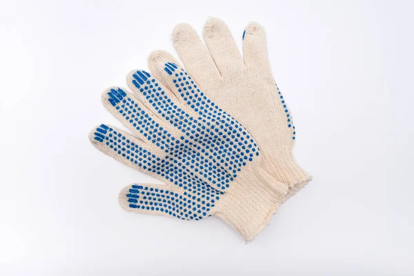 Bauarbeiter schützende gestrickte Handschuhe auf weißem Hintergrund, Handschutz und Sicherheit beim Bauen — Stockfoto