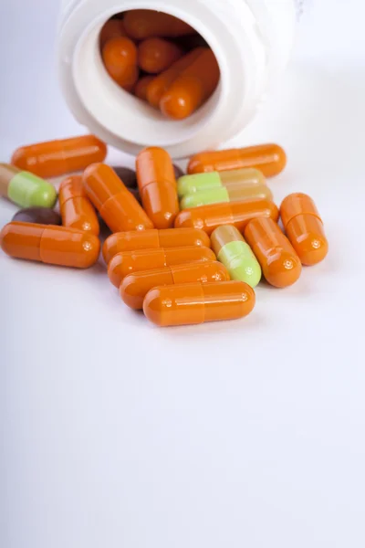 Capsules with a bottle — Stock Photo, Image