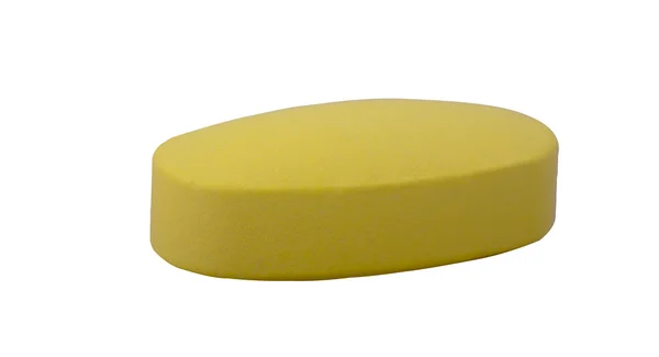 Жовта таблетка ізольована на білому тлі — стокове фото