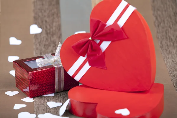 Red box in heart shape on an artistic background — Stock Photo, Image