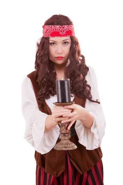 Piratenmädchen mit einer Kerze in der Hand — Stockfoto