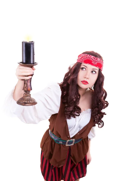 Piratenmädchen mit einer Kerze in der Hand — Stockfoto