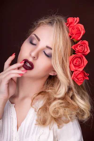 Sexy woman with flowers in head on brown background — Stock Photo, Image