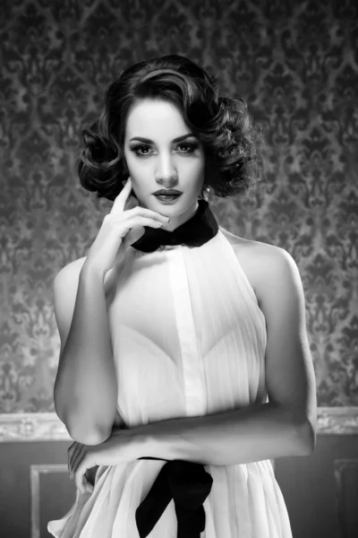 Black and white sensual woman in vintage room — Stock Photo, Image