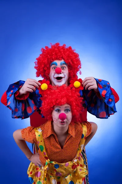 Clown couple on blue background — Stock Photo, Image