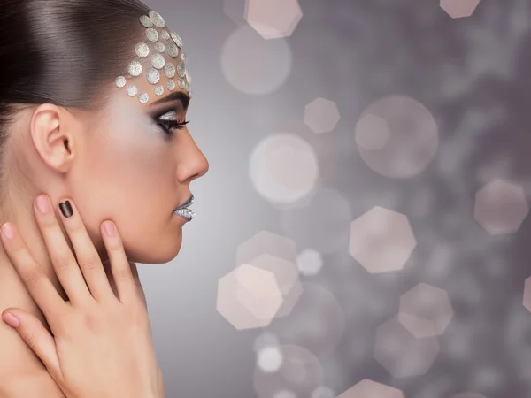 Woman professional make up on blurry background — Stock Photo, Image