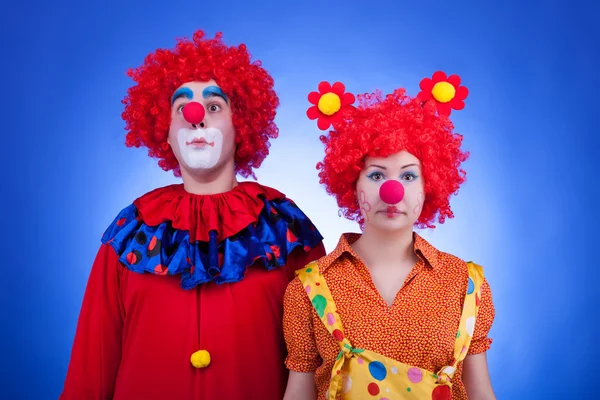 Clown couple on blue background — Stock Photo, Image