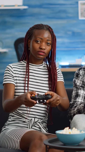 African american couple losing video game match