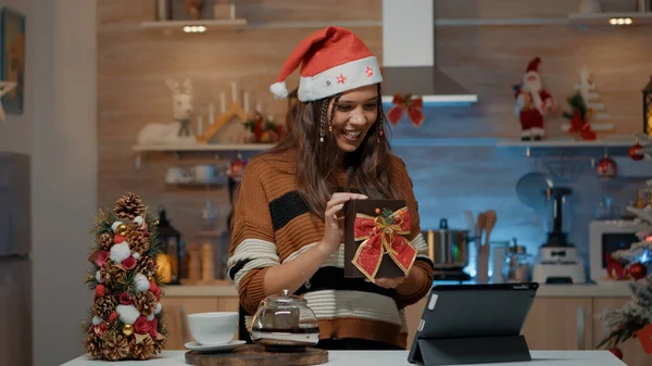 Smiling woman using video call technology for presents — Stock Photo, Image