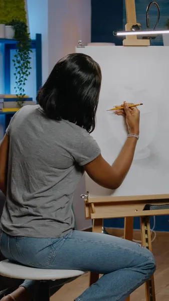 African american woman artist creating vase design using pencil — Stock Photo, Image