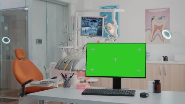 Nadie en la oficina de estomatología con pantalla verde en el ordenador — Vídeos de Stock