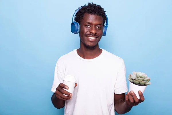 African american man listening to music on headphones — Stock Photo, Image