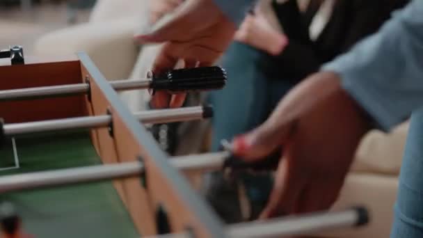 Close up of woman using foosball game table to do fun activity — Stock Video