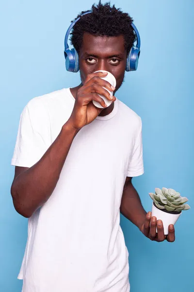 African american man listening to music on headphones — Stock Photo, Image