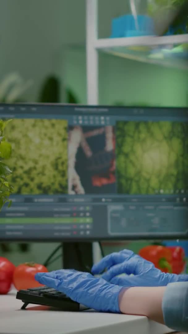 Vertical video: Researcher woman measuring eco sapling while observing biological transformation — Stock Video