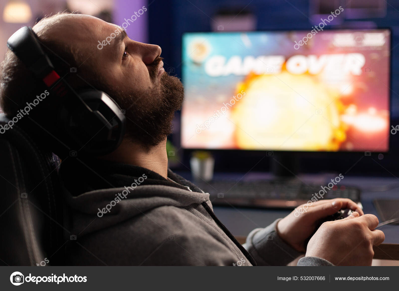 Free Photo  Player winning video games with controller and headset in  front of monitor. man using joystick and headphones, playing online games  on computer. person celebrating game win for leisure.