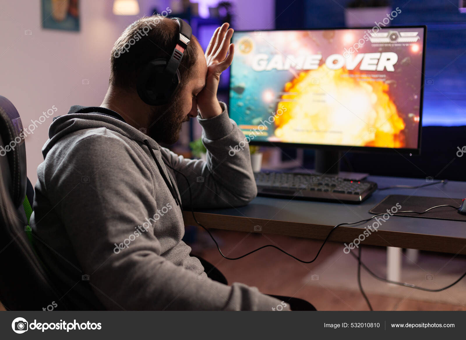 Free Photo  Gamer using controller to play online video games on computer.  man playing game with joystick and headphones in front of monitor. player  having gaming equipment, doing fun activity.