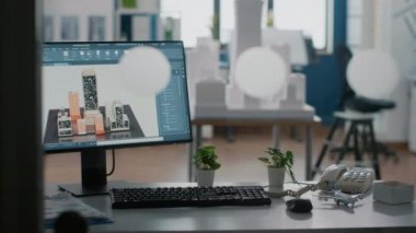 Ofisteki masada 3D bina ve inşaat düzeniyle monitörü kapat.