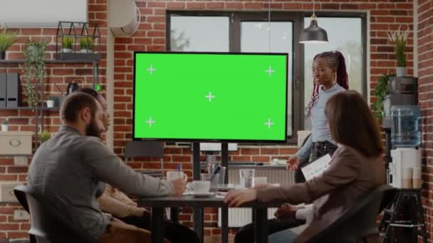 Business people doing presentation with green screen on monitor