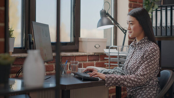 Employee working on business project with computer