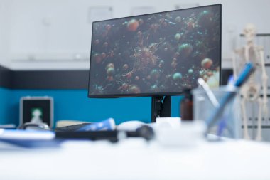 İçinde virüs hücresi çizimi olmayan boş bir tıp bürosu.