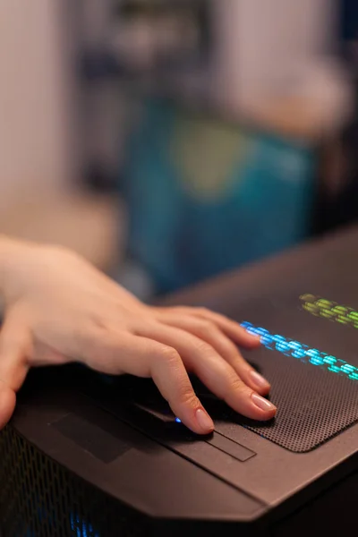 Woman gamer pressing button on RGB computer preparing for space shoother videogame — Fotografia de Stock