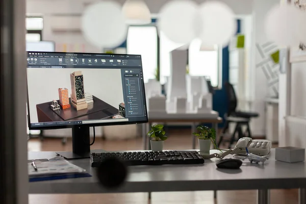 Closeup of modern architect desk with workstation showing 3d blueprints — Zdjęcie stockowe