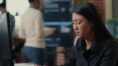 Portrait of infuriated software developer focused on writing code after encountering unexpected compiling error