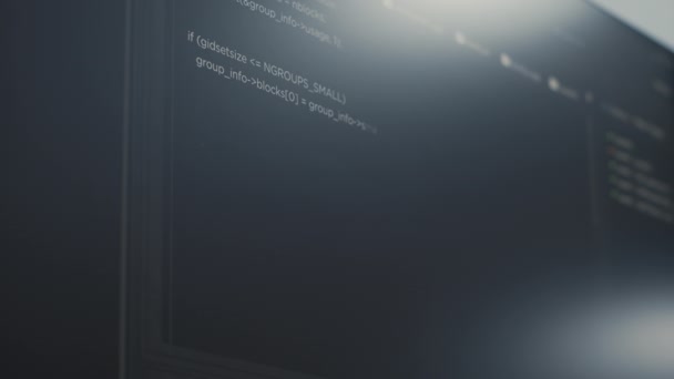 Closeup of computer display of software developer typing database functions script — Stockvideo