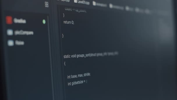 Closeup of computer screen of software developer typing programming language — Stockvideo