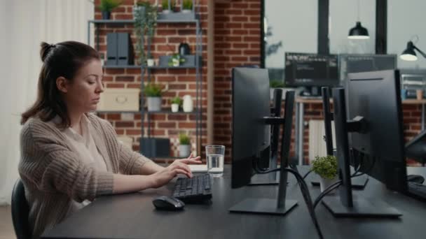 Software engineer typing source code on computer keyboard turning head and smiling — Vídeos de Stock