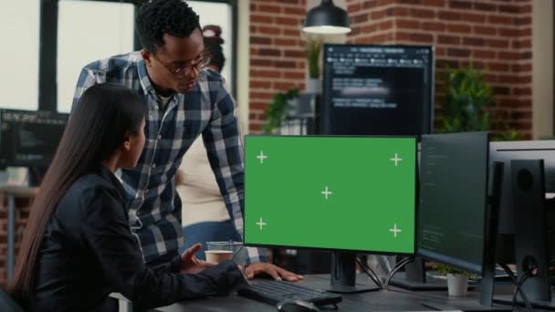 Mixed team of programmers analyzing source code looking at green screen chroma key mockup — Video