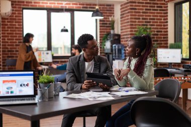 Corporate entrepreneurs analyzing marketing statistics