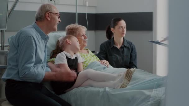 General practitioner talking to ill patient and — 비디오