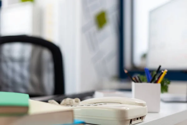 Closeup of phone on desk in empty business office. — Stok fotoğraf